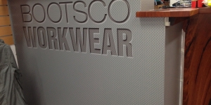 Maroochydore-Bootsco-Workwear-reception-desk-signage-wall-wrap-desk-wrap